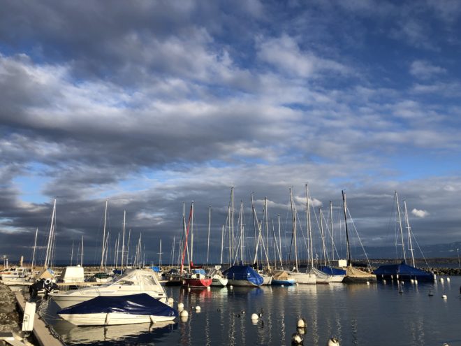 Boats and clouds at the Port de Crans