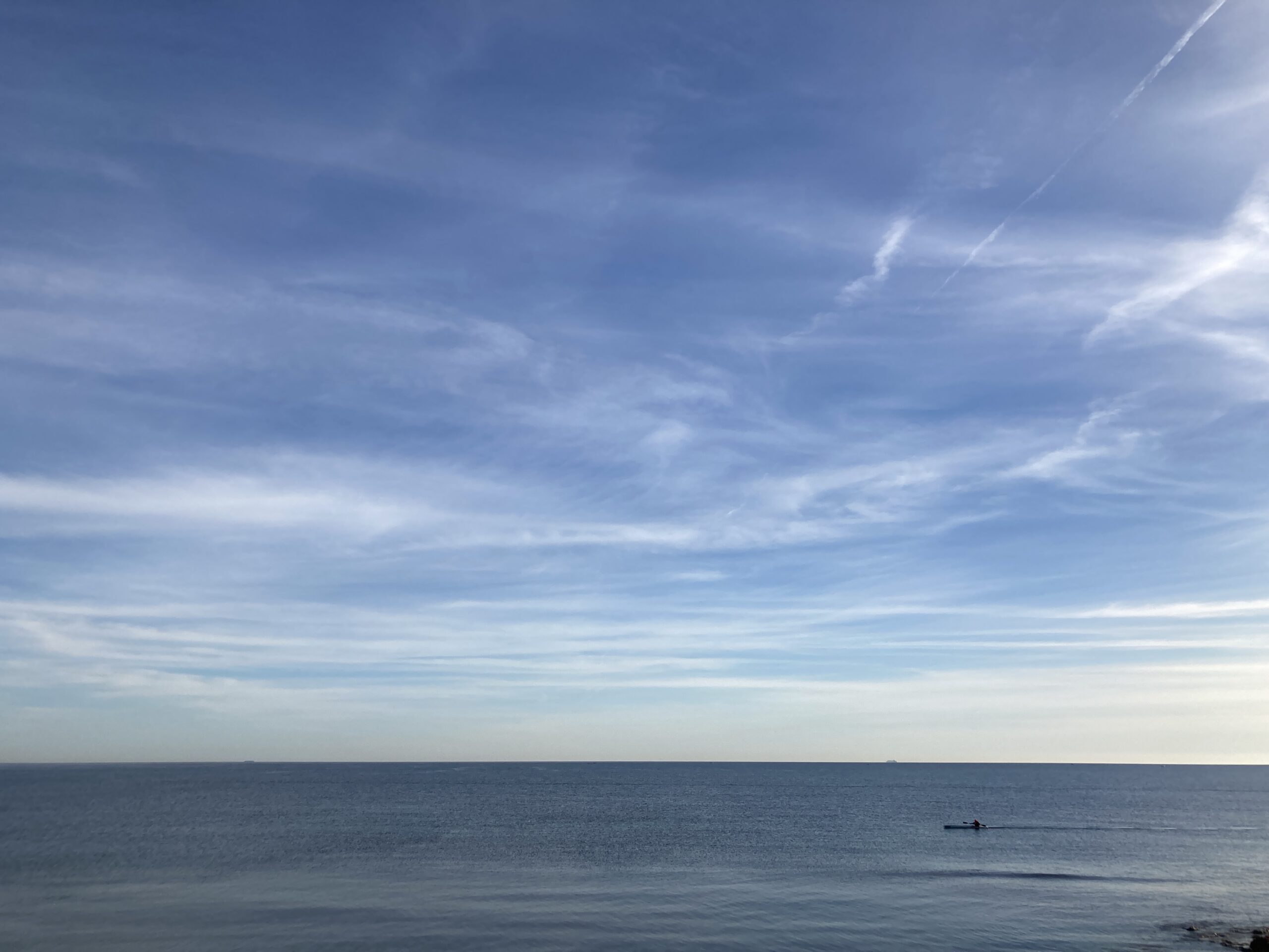 A kayak on a flat sea