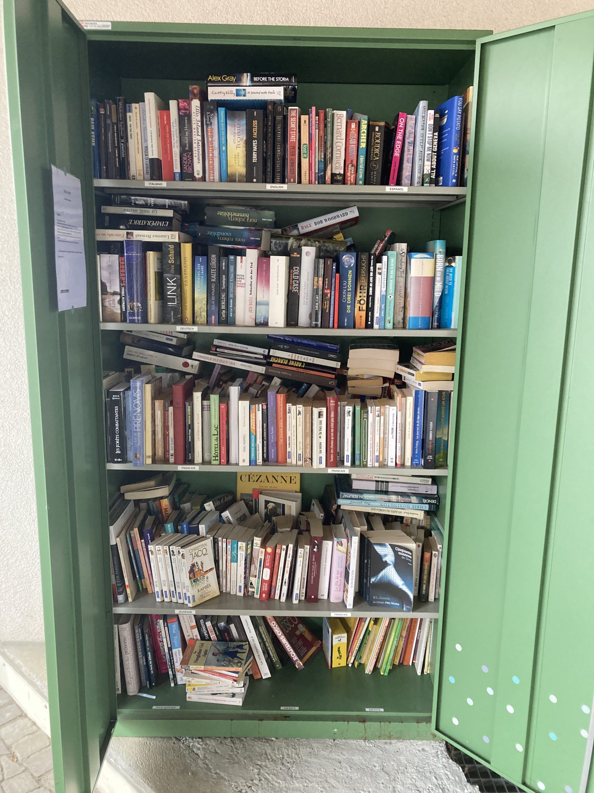 A cupboard filled with books