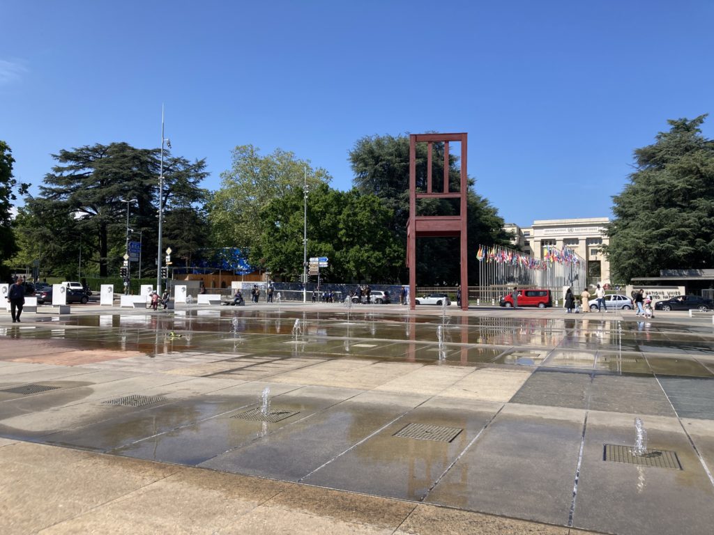 Place Des Nations with the broken chair, and the fountains 