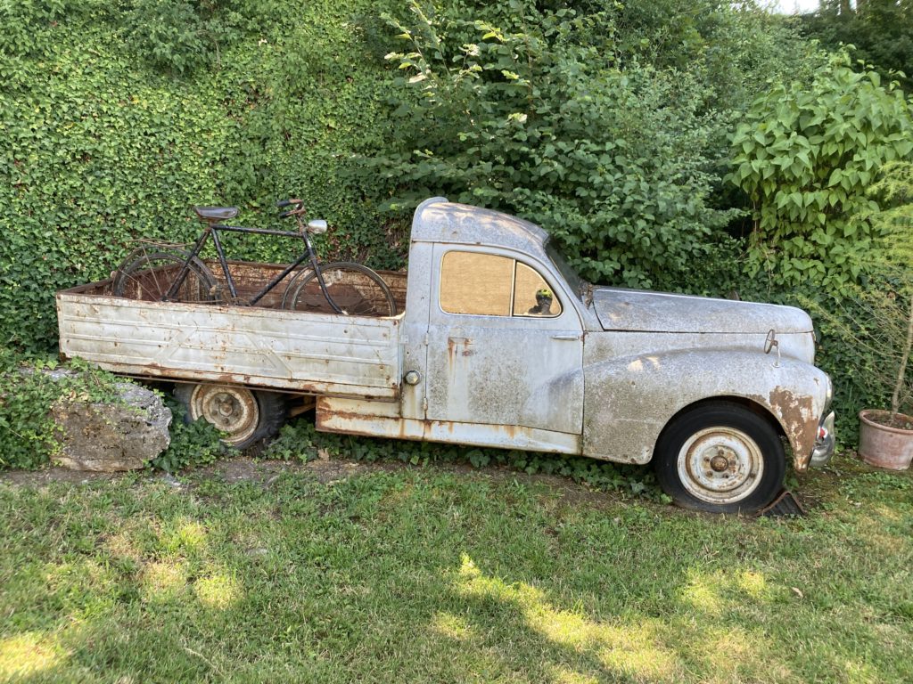 An old pickup truck and bike
